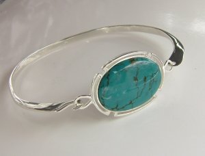 Silver bangle with 25mm x 18mm oval Turquoise cabochon 
