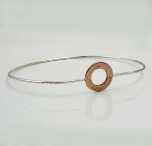 Silver bangle with copper circle