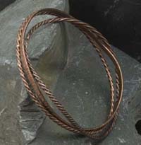 Set of three copper bangles