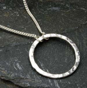 Silver round washer type hammered effect pendant