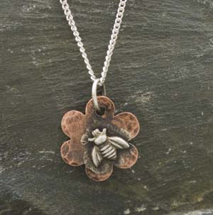 Small flower copper pendant stamped with bee