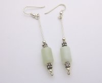 Jade oval cylinders with silver beads strung on silver wire