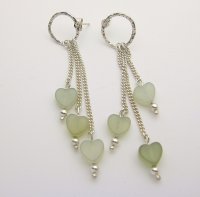 Three jade hearts on fine silver curb chain suspended from hand crafted hammered effect silver ring